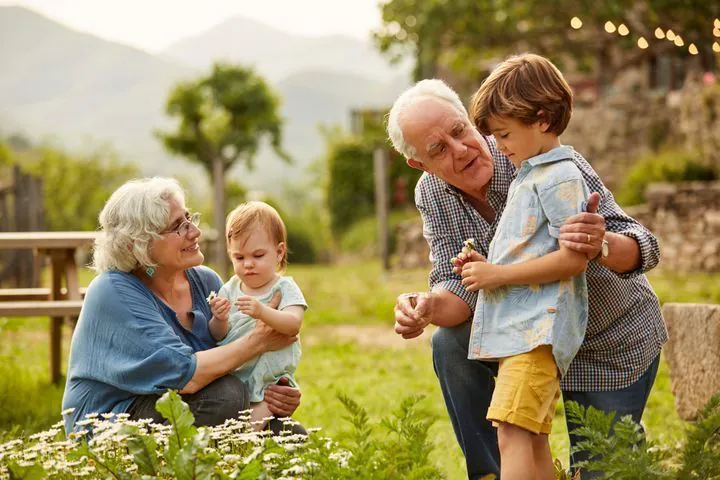 Grandparents laughing with family